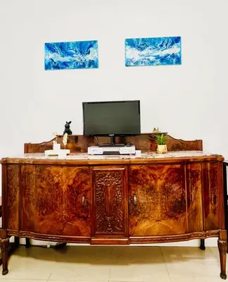 a wooden desk with a computer on top of it at Elegant Apartment Villa Bianca in Rome