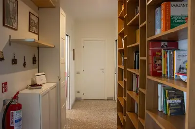a room with a refrigerator and a book shelf at Luminoso non lontano dalla stazione TERMINI in Rome