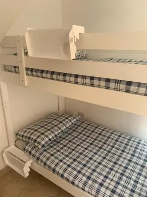 two bunk beds in a room with a mattress at Giava Home in Rome