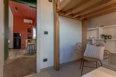 a living room with chairs and a table at Viola Penthouse with Rome Panoramic View in Rome