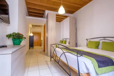 a bedroom with a bed in a room at HT BILO 2 COLOSSEO in Rome