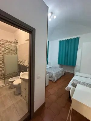 a bathroom with a sink and a toilet and a tub at TERMINI STAR in Rome