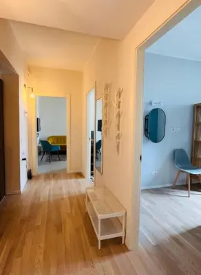 a living room with wooden floors and yellow walls at Casa Duci in Rome