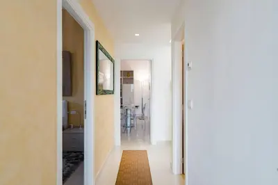 a hallway with a hallway leading to a room at Brightful Boutique Apartment in the Heart of Trastevere in Rome