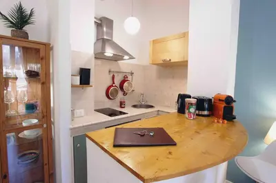 a kitchen with a wooden counter top in a room at Urbana Suite in Rome
