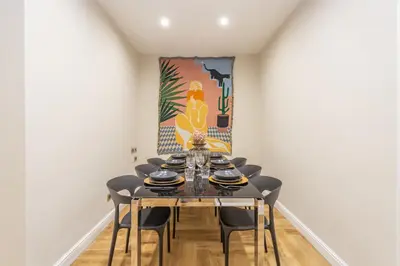 a dining room with a table and chairs at Daplace - Livia Apartment in Rome