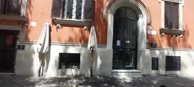 two white umbrellas sitting on the side of a building at Amazing penthouse in the heart of Rome in Rome
