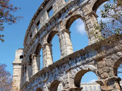ancient ruins of a building with arches at Apartment Le Colonne by Interhome in Rome