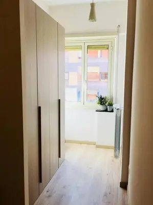 an empty room with a window and a wooden floor at Maison de' Trastevere in Rome