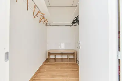 a hallway with a bench in the middle of a room at iFlat Lovely Modern Apartment in Rome