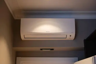 a television hanging from a ceiling in a room at Domus 213 Guest House - Boutique Suites in Auditorium, MAXXI, Villa Borghese, Piazza del Popolo in Rome