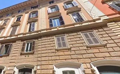 a large brick building with many windows on it at Domus Iulius in Rome
