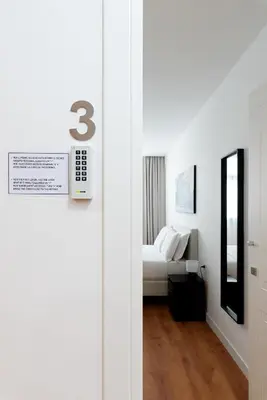 a door leading to a bedroom with a bed at Roma Mia in Trastevere in Rome