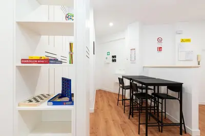 a kitchen and dining room with a table and chairs at Roma Mia in Trastevere in Rome