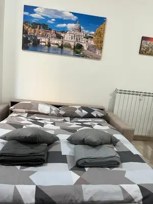 a bedroom with two beds with pillows on it at Monti Exclusive Apartment in Rome