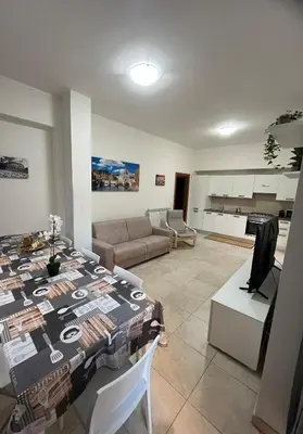 a living room with a table and a couch at Monti Exclusive Apartment in Rome