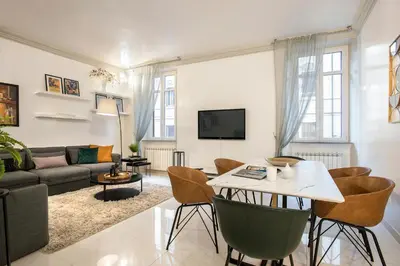 a living room with a table and a couch at Angelique Boutique in Rome