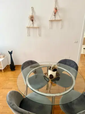 a glass table and chairs in a room at Volupta's House Janiculum Hill in Rome