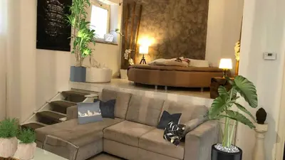a living room with a couch and a bed at Boncompagni Suite Roma in Rome
