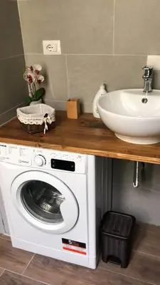 a washing machine and a sink in a bathroom at Boncompagni Suite Roma in Rome