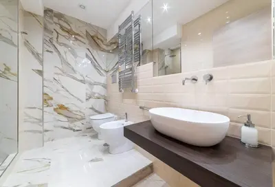 a bathroom with a white sink and a toilet at 50 Gandino Deluxe in Rome