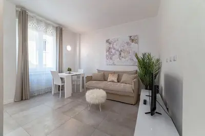 a living room with a couch and a table at 35 Gozzadini in Rome