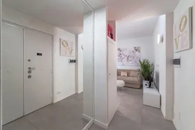 a hallway with a living room with a couch at 35 Gozzadini in Rome