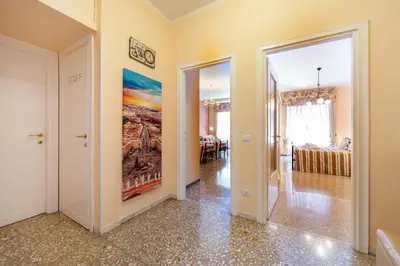a living room with a painting on the wall at Ila Guest House in Rome