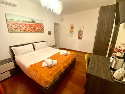 a bedroom with a bed with two towels on it at Tre Fiori in Rome