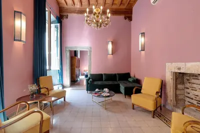 a living room with a couch and a fireplace at Appartamento Tor Millina 4 Piazza Navona in Rome