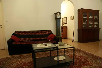 a living room with a couch and a clock at San Peter’s Heaven’s Door in Rome