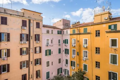 a row of colourful buildings in a city at Casetta Giolitti, Cozy Apt in the Heart of Rome in Rome
