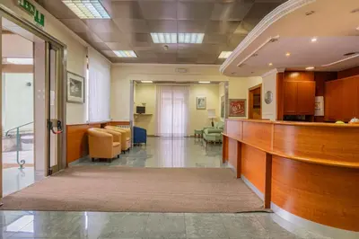 a hospital hallway with a waiting area and a waiting room at Hotel Monte Verde in Rome