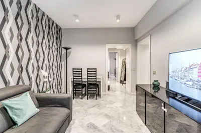 a living room with a couch and a flat screen tv at R22 Apartment in Rome