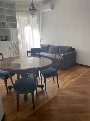 a living room with a table and a couch at Splendido appartamento in Rome