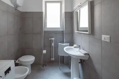 a bathroom with a toilet and a sink at Caffarella Park View Rome in Rome