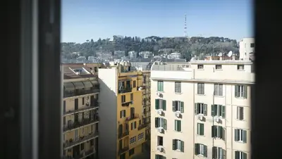 a view from a window of a city with buildings at The Attico_Prati in Rome