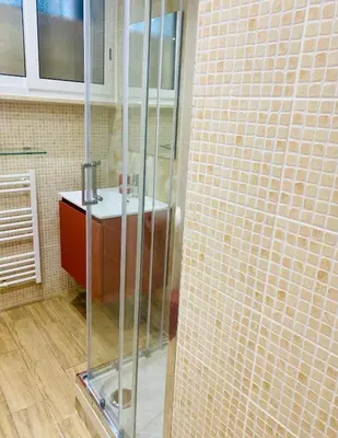a bathroom with a glass shower and a sink at Locazione Turistica- Maxxi loft in Rome