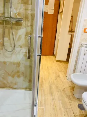 a bathroom with a shower and a toilet at Locazione Turistica- Maxxi loft in Rome