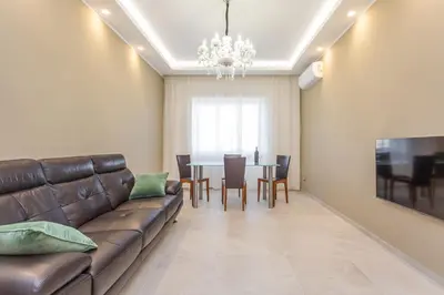 a living room with a couch and a table at 2-Bedroom Retreat near Metro & Parks in Rome