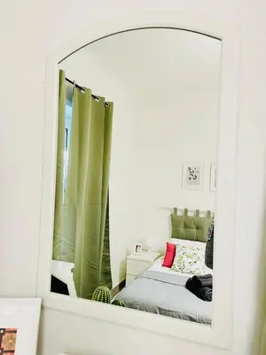 a green couch sitting in a living room with a coffee table at Holiday Homes Rome - Monte Verde 61 - near Trastevere in Rome