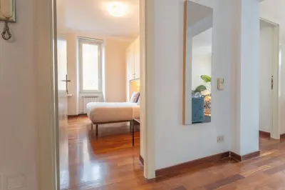 a bedroom with a large white bed and a window at PgrHome Barberini in Rome
