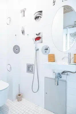 a bathroom with a shower with a woman with red lipstick at Lion 99 in Rome