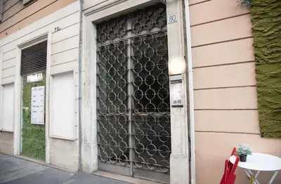 a window of a building with a metal grate at Venus Penthouse - Favoloso attico in pieno centro a Roma in Rome