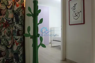 a room with a curtain with a plant in it at Cozy Haven near Caracalla Baths Your Home in San Giovanni in Rome
