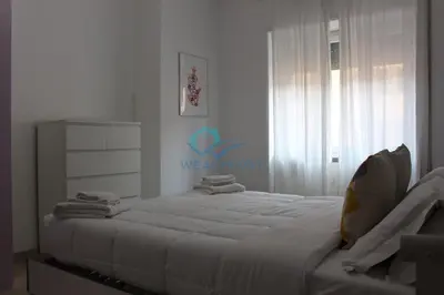 a bedroom with a large bed in a room at Cozy Haven near Caracalla Baths Your Home in San Giovanni in Rome