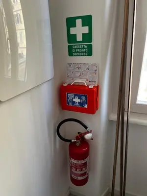 a fire extinguisher and a fire hydrant on a wall at Love4Rome Guest House in Rome