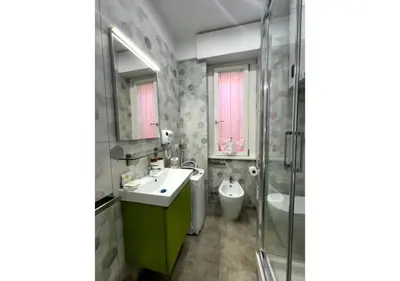 a bathroom with a sink and a shower at La Palmetta - Vicino Metro A in Rome