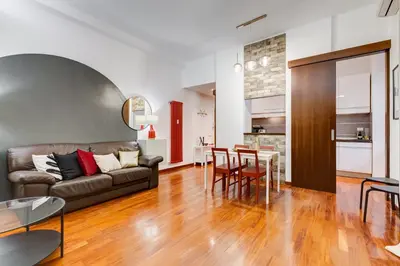 a living room with a couch and a table at BDC - Fancy 2-Bdr Apt @Vatican in Rome