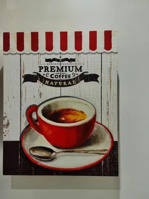 a cup of coffee on a plate with a spoon at Suite Castelfidardo 50 in Rome